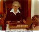 Photo of Nannie Failon opening a Christmas present in late 1978.